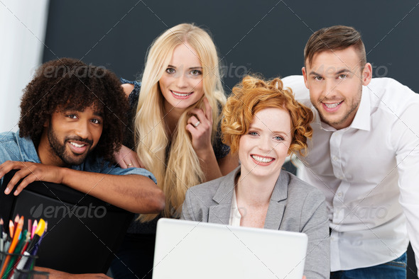 Smiling successful young multiracial business team - Stock Photo - Images