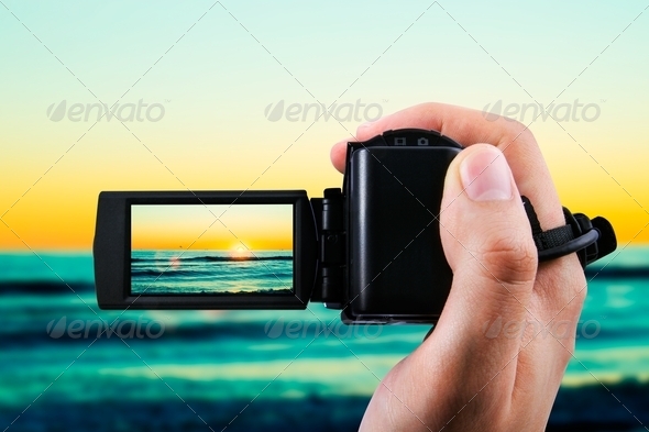 Video camera or camcorder recording sunset