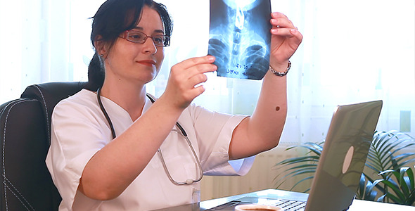 Doctor Examining X-Ray Films Doctor Examining X-Ray Films