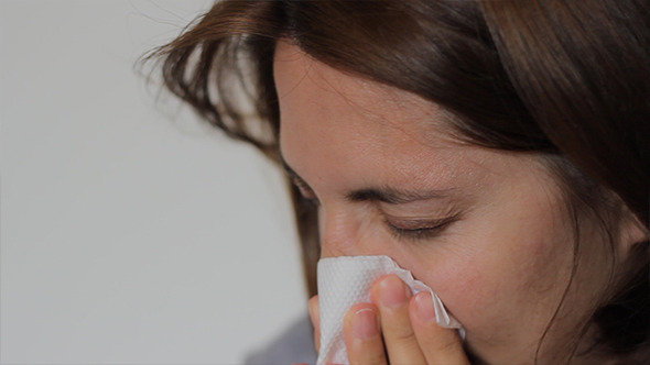 Woman is Blowing Nose Woman is Blowing Nose