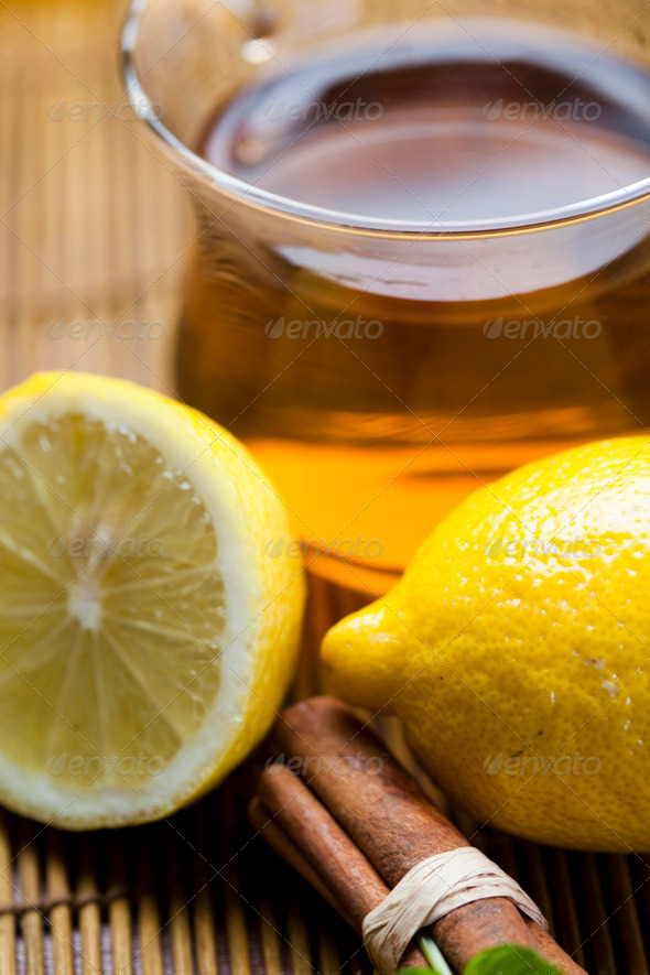 Glass teapot and cup with tea, lemon (Misc) Photo Download