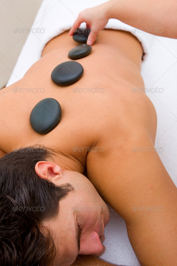 Man having hot stone massage