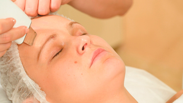 Young Woman Taking Facial Treatments Of Ultrasonic Young Woman Taking Facial Treatments Of Ultrasonic