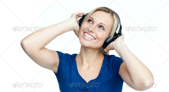 Happy woman listening to music with headphones on (Misc) Photo Download