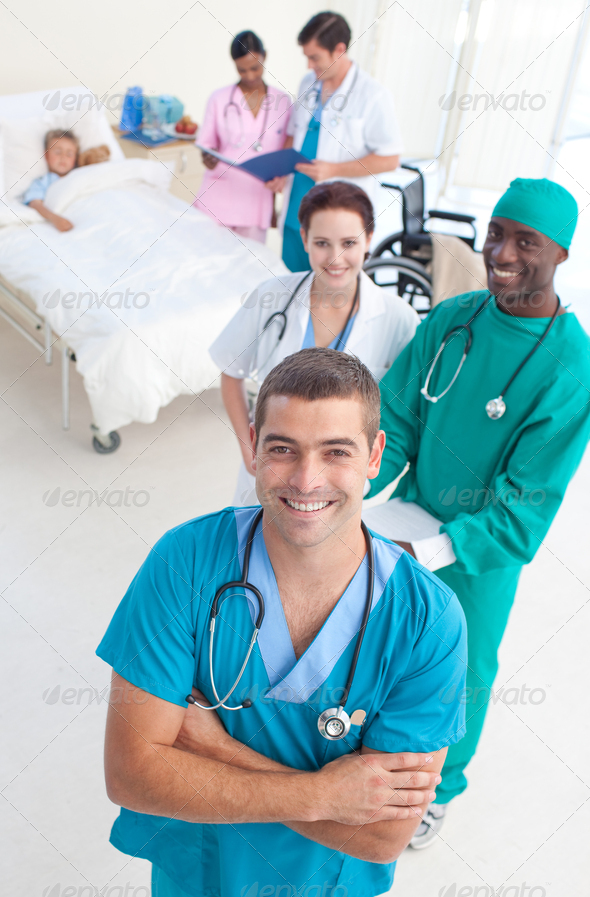 High angle of medical team attending to a young patient (Misc) Photo Download