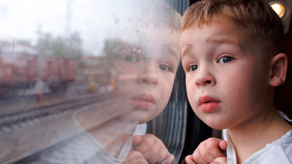 Curious Boy Looking Out Of The Train Window Curious Boy Looking Out Of The Train Window