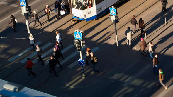 Pedestrians Walking Across The Road In The City Pedestrians Walking Across The Road In The City