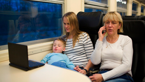 Son With Mother Watching Video In Train Son With Mother Watching Video In Train
