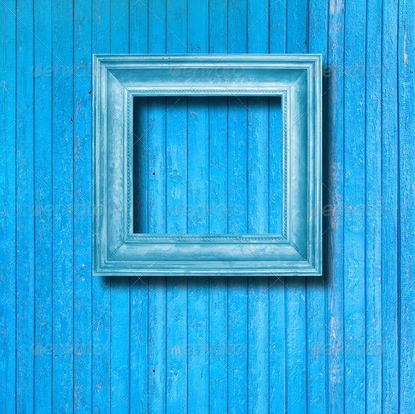 Vintage frame for picture on blue wooden wall (Misc) Photo Download