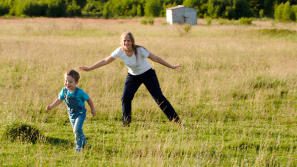 Mother And Her Son Playing Bo-Peep Outdoor Mother And Her Son Playing Bo-Peep Outdoor