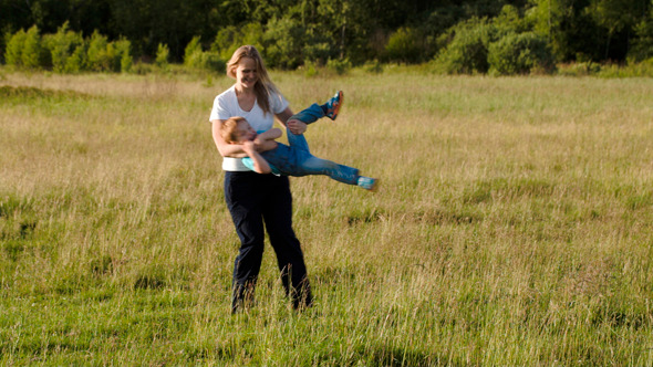 Young Mother Playing With Her Son Outdoor Young Mother Playing With Her Son Outdoor