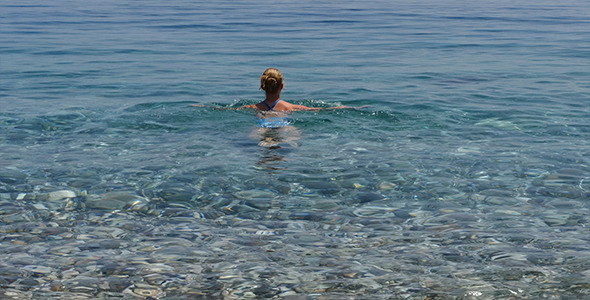 Young Girl In Transpsrent Sea Water