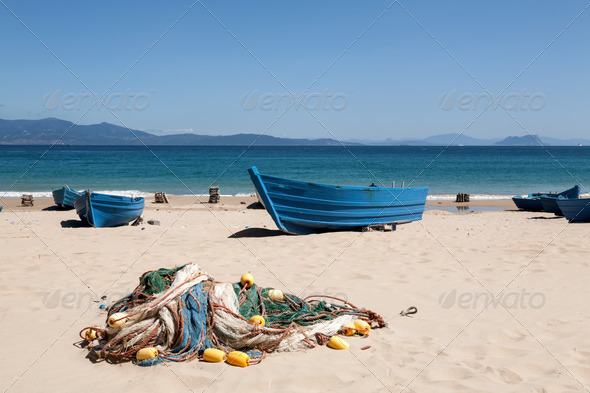 Fishing boat on the beach sand