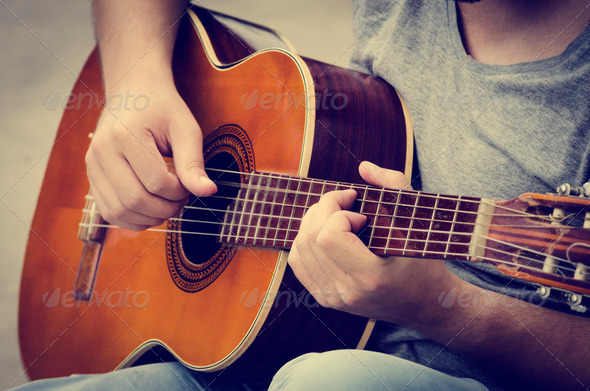 Man plays the guitar (Misc) Photo Download