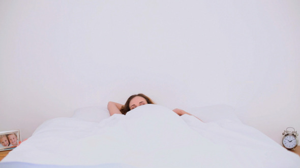 Young Model Waking Up In Her Bed And Stretching Young Model Waking Up In Her Bed And Stretching