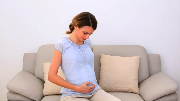Pregnant Woman Rubbing Her Painful Neck Pregnant Woman Rubbing Her Painful Neck