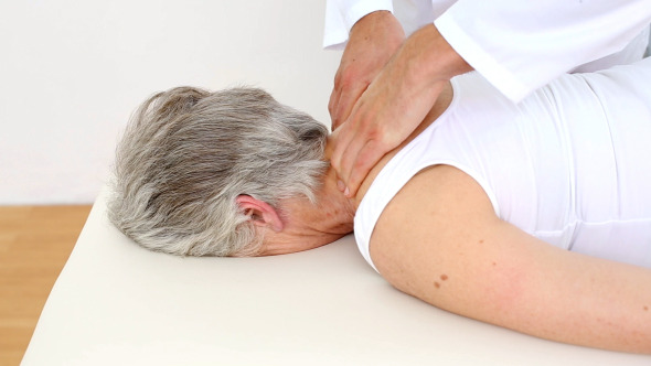 Doctor Massaging Senior Patients Shoulders Doctor Massaging Senior Patients Shoulders