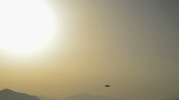Plane Passing at Sunset Plane Passing at Sunset