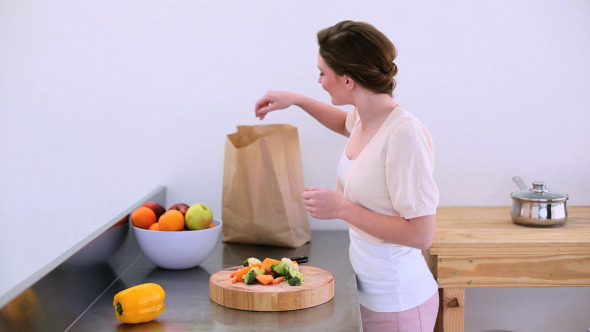Pretty Model Standing In Kitchen With Peppers 2 Pretty Model Standing In Kitchen With Peppers 2