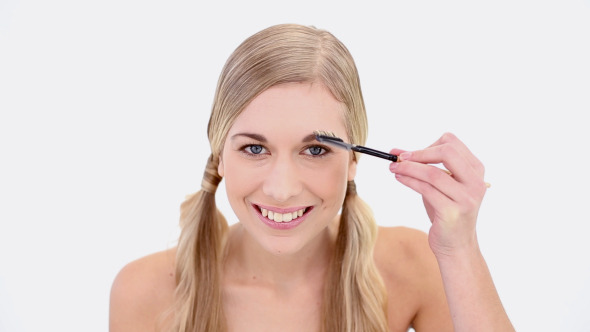 Happy Nude Blonde Using Eyebrow Brush Happy Nude Blonde Using Eyebrow Brush