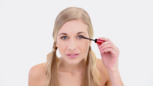 Happy Nude Blonde Applying Mascara Happy Nude Blonde Applying Mascara