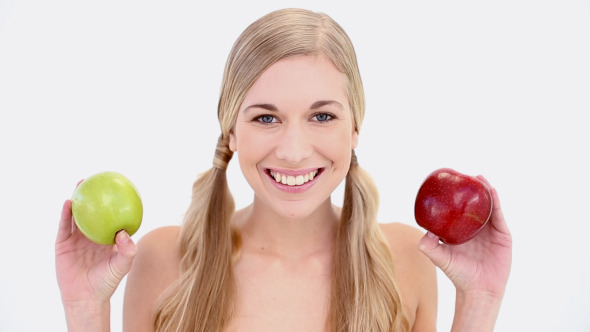 Happy Nude Blonde Holding Red And Green Apples Happy Nude Blonde Holding Red And Green Apples