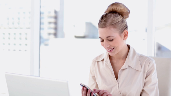Happy Blonde Businesswoman Texting Happy Blonde Businesswoman Texting