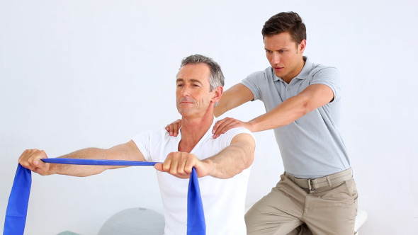 Physiotherapist Checking Senior Patient Stretching 2 Physiotherapist Checking Senior Patient Stretching 2