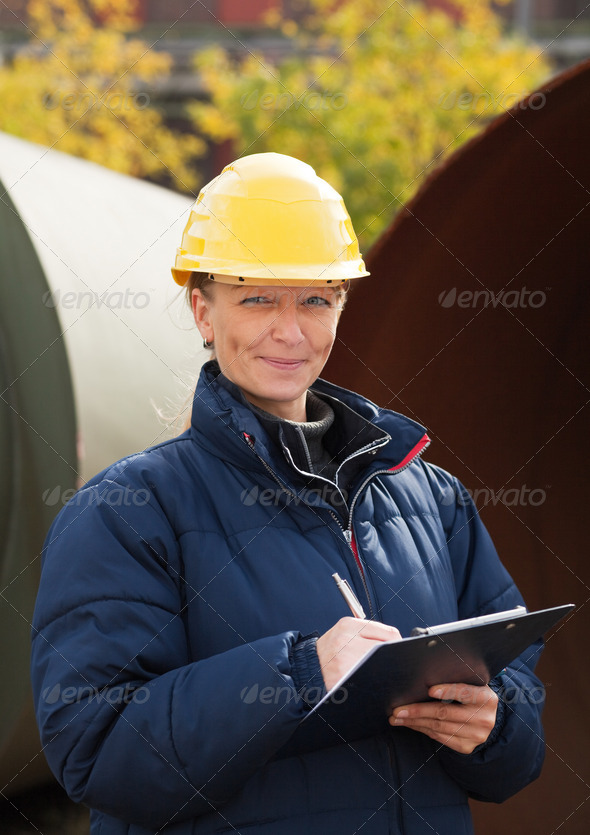 Construction engineer takes notes
