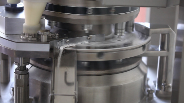 Pills Falling Out Of Pill Manufacturing Machine Pills Falling Out Of Pill Manufacturing Machine