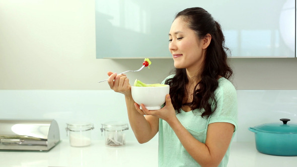Smiling Woman Eating Salad Smiling Woman Eating Salad