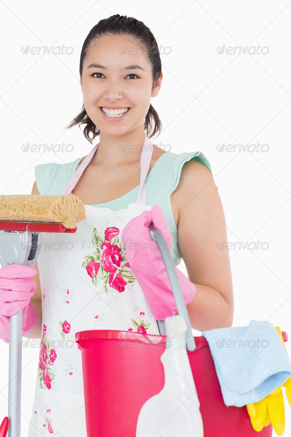 Happy woman holding different cleaning tools on a white background (Misc) Photo Download