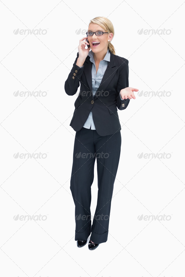 Hapy businesswoman talking on mobile phone and being surprised (Misc) Photo Download