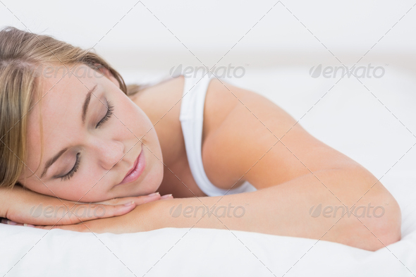 Calm woman napping on the bed in the white bedroom (Misc) Photo Download