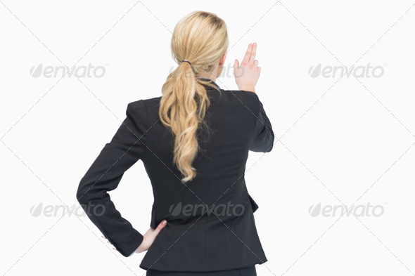 Business woman pointing out something from behind (Misc) Photo Download