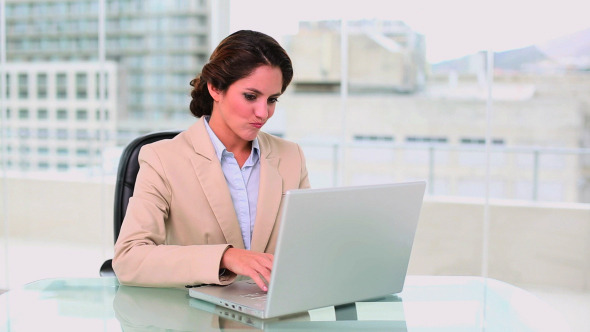 Concentrated Attractive Businesswoman Using Laptop Concentrated Attractive Businesswoman Using Laptop