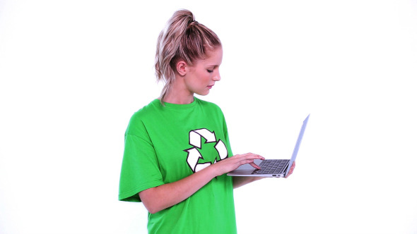 Young Blonde Environmental Activist Using Notebook Young Blonde Environmental Activist Using Notebook