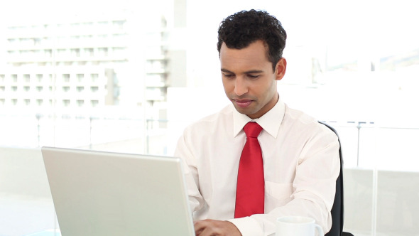 Cheerful Handsome Businessman Typing On Laptop Cheerful Handsome Businessman Typing On Laptop