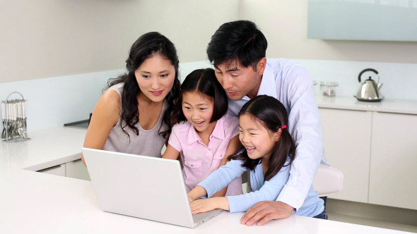 Happy Family Using Laptop Together Happy Family Using Laptop Together
