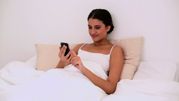 Smiling Beautiful Woman Using A Mobile Phone Smiling Beautiful Woman Using A Mobile Phone