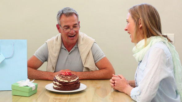 Wife Surprising Her Husband With A Present Wife Surprising Her Husband With A Present
