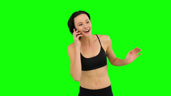 Fit Brunette Talking On The Phone 1 Fit Brunette Talking On The Phone 1