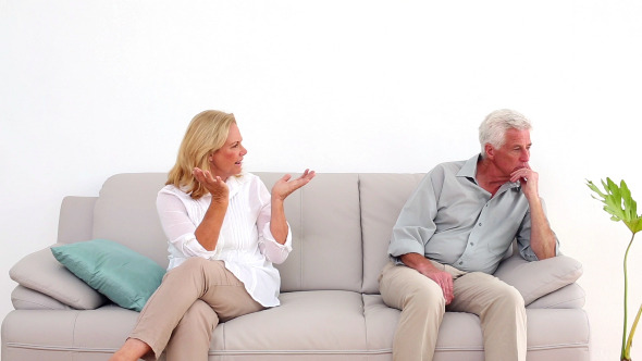 Retired Couple Arguing On The Couch Retired Couple Arguing On The Couch