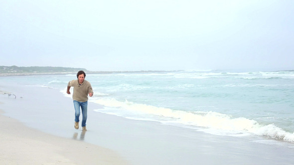 Happy Man Running Towards Camera On The Beach Happy Man Running Towards Camera On The Beach