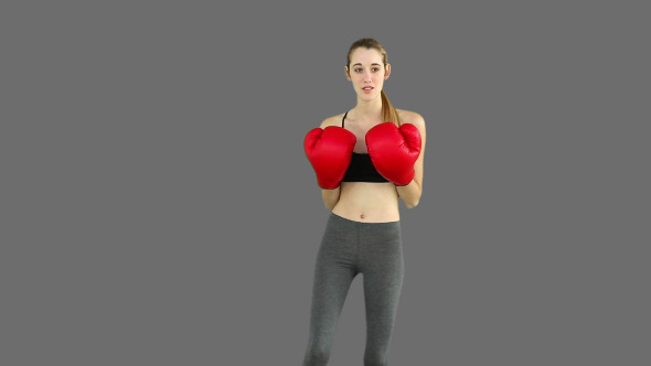 Fit Model Punching With Red Boxing Gloves 2 Fit Model Punching With Red Boxing Gloves 2