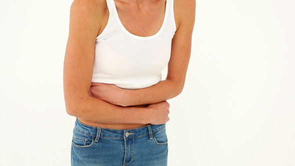 Slim Model In Jeans With A Stomach Cramp Slim Model In Jeans With A Stomach Cramp